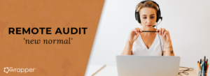 A professional woman wearing a headset and working at a laptop, representing a remote audit conducted via teleconferencing technology to maintain QMS compliance.