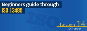 Blue header banner for "Beginners guide through ISO 13485" Lesson 14, featuring the qmsWrapper logo and a globe graphic illustrating international medical device quality standards.