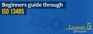 Blue header banner for "Beginners guide through ISO 13485" Lesson 5, featuring the qmsWrapper logo and a globe graphic.